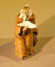 unknown Miniature Figurine: Man Holding a Cup Sitting on a Rock <br>Blue Color - Fine Detail