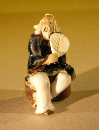unknown Miniature Figurine: Man Holding a Fan Sitting on a Rock - Blue Color - Fine Detail