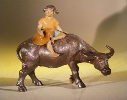 unknown Miniature Figurine: Girl Riding on a Buffalo