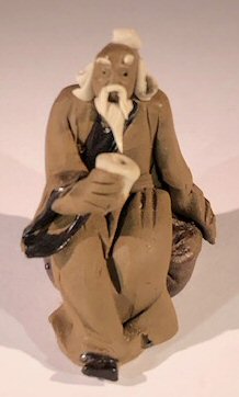 unknown Miniature Figurine: Man Holding a Cup Sitting on a Rock - Light Brown Color - Fine Deta