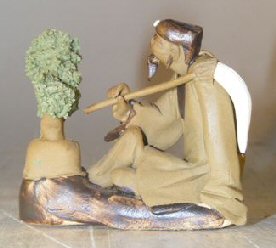 unknown Ceramic Figurine: Man with Bonsai Tree Holding a Brush