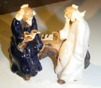 unknown Miniature Glazed Figurine<br>Two Men Sitting on a Bench Reading Books<br>Color: Blue & White